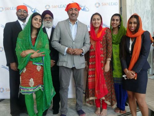 Rep. Ami Bera is flanked by SikhLEAD interns and leaders of SALDEF at the fourth annual Langar on Capitol Hill on July 24, 2017.