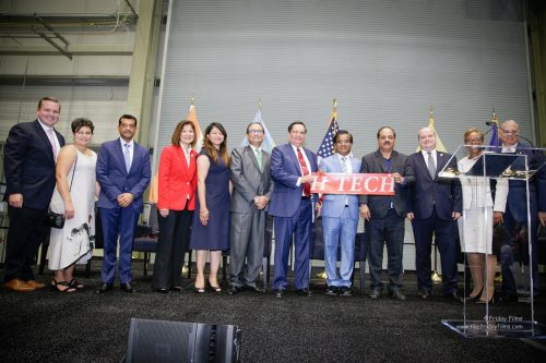 Dr. Kris Singh (seventh from left) and Dr. Sanjay Gupta (fifth from right) at the ribber-cutting ceremony of Holtec International's new Singh Nuclear Technology Campus in Camden, NJ, on September 15, 2017.