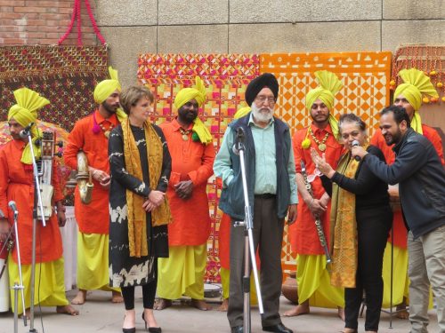 At the fifth annual Mela Phulkari are seen in the front from left to right: MaryKay Carlson, Deputy Chief of Mission at the American Embassy in Delhi; former Union Minister M.S. Gill; art historian Dr. Alka Pande; and RJ Jassi of Chandigarh. Looking on are the Sardars of Sangrur, exceedingly talented musicians highlighting the folk instruments of Punjab