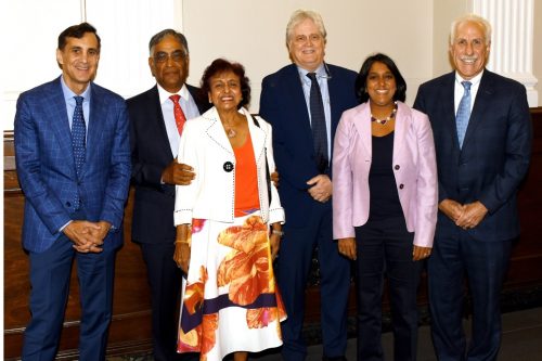 Gupta (second from left), with wife Kamla (third from left) and daughter Amita Gupta (second from right) at the dedication ceremony of the Raj & Kamla Gupta Professor of Infectious Diseases at Johns Hopkins University in Baltimore on September 5. Others seen are the inaugural recipient Robert Bollinger (third from right), Johns Hopkins University President Ronald Daniels (left) and Dr. Paul Rothman, Dean of the Johns Hopkins School of Medicine (right).