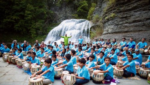 100 tabla players perform near Ithaca, NY, waterfall abla players from the Taalim School of Indian Music performing at the Robert H. Treman State Park in Ithaca, New York, on September 22.