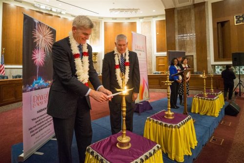 US lawmakers greeted by overflow crowd of Indian Americans at Diwali celebration on Capitol Hill Sen. Bill Cassidy lights the 'diya' (lamp) at the 2018 Diwali celebration on Capitol Hill. Looking on, from left to right, are: Congressman Pete Sessions; and Congresswomen Pramila Jayapal and Grace Meng. Photo credit: BAPS