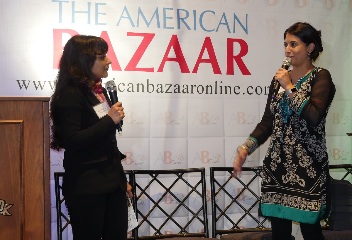 Sonia Kotecha, who received the Women Leaders of the Year award on behalf of SAALT Executive Director Suman Raghunathan and other women leaders of the organization, being interviewed on stage by University of Texas at Arlington historian Dr. Ritu Khanduri at the American Bazaar Women Entrepreneurs and Leaders Gala in Bethesda, MD, on November 16, 2018.