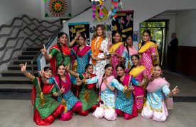 First Lady Melania Trump is flanked by exuberant students who danced to Bhangra beats during her visit to the Sarvodaya Co-Educational Senior Secondary School in New Delhi. Official White House Photo by Andrea Hanks