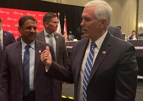 Indian American hotelier Danny Gaekwad (left) with Vice President Mike Pence in Orlando on Wednesday. Gaekwad represented AAHOA at a roundtable of business leaders hosted by Pence on reopening the economy.