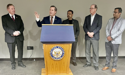 Reps. Mike Waltz (R-FL) addressing delegates of the Asian American Hotel Owners' Association at a congressional reception hosted by the organization in Washington, DC, on March 7, 2023. Looking on are (from left to right) Rep. Neal Dunn, AAHOA Government Affairs Committee Chair Danny Gaekwad, Sen. Mike Braun (R-IN) and member of the AAHOA Florida Regional Rahul Patel.