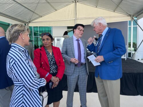 Dr. Pallavi Patel (second from left) and Dr. Kiran Patel (second from right) engage with guests during the opening of the Orlando College of Osteopathic Medicine on March 9, 2024. The Patels have already committed over half a billion dollars to various philanthropic initiatives and are on track to reach a billion dollars in spending.