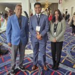 Aaron George (center) with parents Raghu and Nirmala.