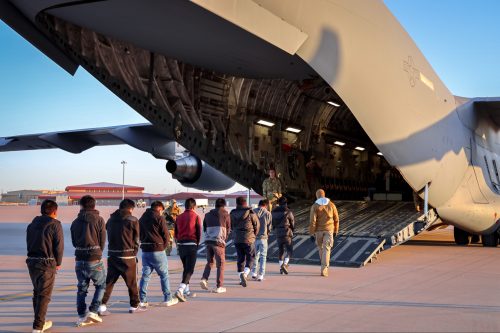Migrants are being deported to India on US military planes Undocumented immigrants apprehended by U.S. officials being escorted to a deportation flight.