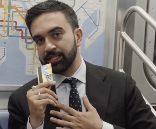 Zohran Mamdani flashes a MetroCard while filming an episode of "Subway Takes with Kareem Rahma," where he discusses issues affecting subway drivers.