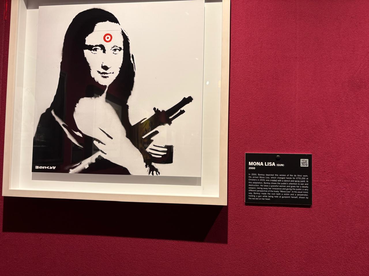 Artwork depicting a reinterpretation of the Mona Lisa holding or associated with a gun