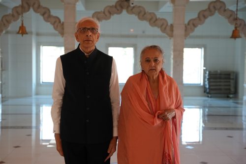 Dr. Jasvant Modi and Dr. Meera Modi pose together at an event. The couple are Indian American philanthropists known for supporting Jain studies, education, and compassion-focused initiatives.