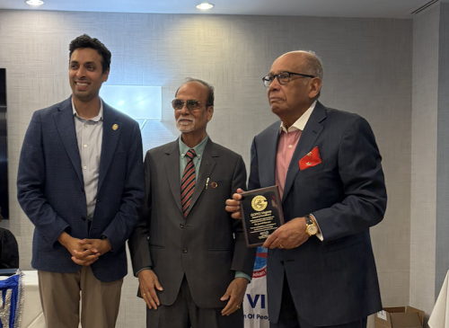 Javad K. Hassan (right) poses for a photo after receiving the GOPIO-Virginia award from Rep. Suhas Subramanyam. Also pictured is GOPIO-Virginia President Jay Bhandari.