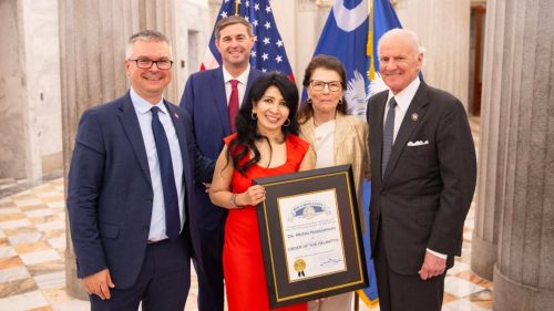 Dr. Meera Narasimhan holds the Order of the Palmetto, South Carolina’s highest civilian honor, at the State House. She is joined by Gov. Henry McMaster, House Speaker Murrell Smith, University of South Carolina Provost Mary Anne Fitzpatrick, and Dr. PK Krajacic, senior associate dean for medical education at the Floyd School of Medicine. Photo: University of South Carolina Floyd School of Medicine