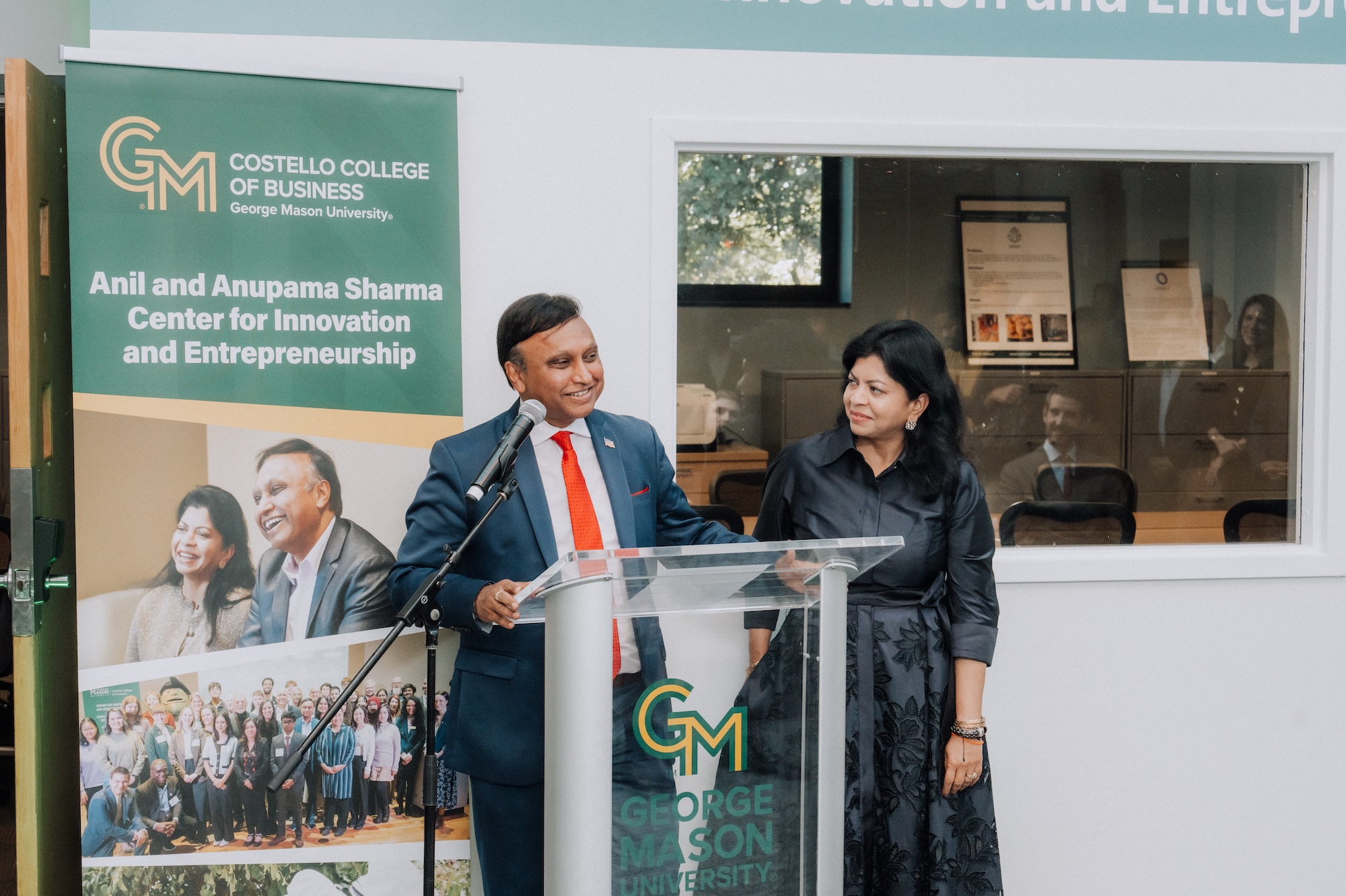 Anil Sharma speaks at a naming ceremony on October 5, with Anumpa standing beside him.